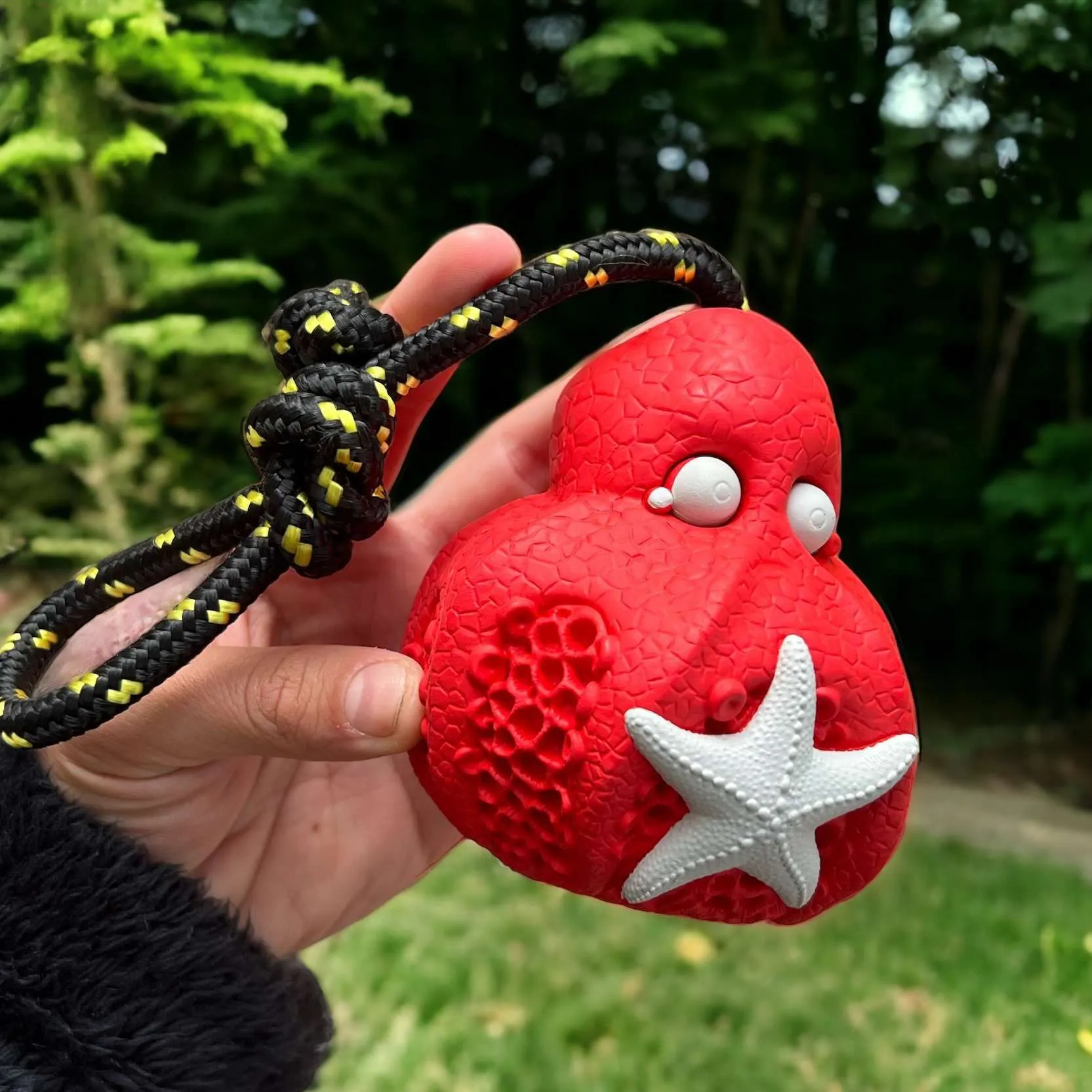 Rubber dog toy with tug rope